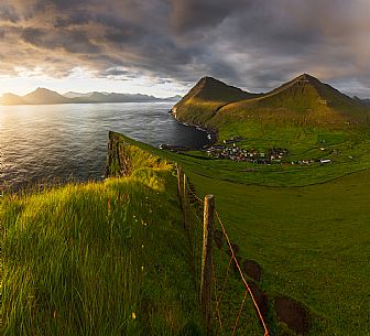 The iconic village of Gjógv, Eysturoy island, Faeroe islands, Denmark, Europe The iconic village of Gjógv, Eysturoy island, Faeroe islands, Denmark, Europe